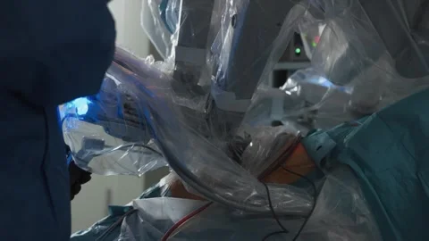 Robotic arms of advanced minimally invasive medical system davinci in action Stock Footage 245619994