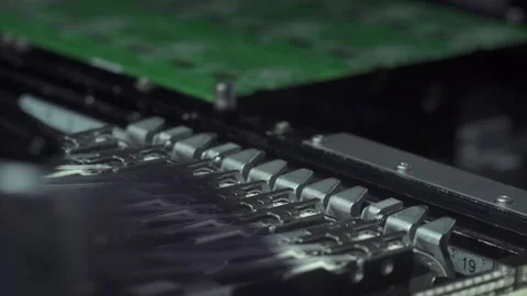 Robotic arms assembling circuit board components with electronic parts close up Stock Footage 248833628