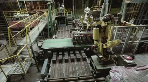 Robotic arms take new batch of bricks and put them to the conveyor Stock Footage 58539740
