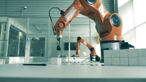 Robotic arms works, stacking white cubes. Stock Footage 138022364