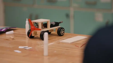 Robotic car being built in stem class at school Stock Footage 283489750