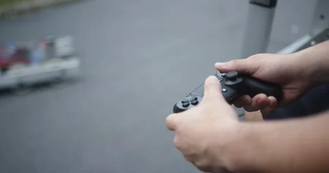 Robotic car being controlled by video game controller Stock Footage 137973079
