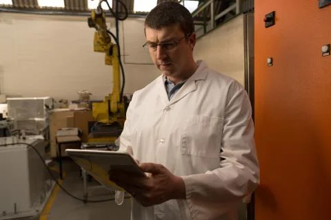 Robotic engineer using digital tablet Stock Photos