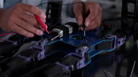 Robotic engineer working on mechanical system of robotic arm, electrical Stock Footage 277209682