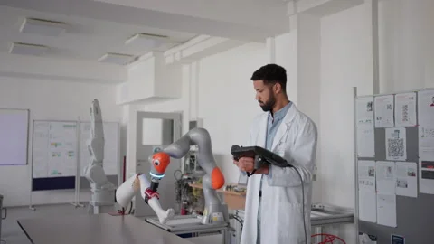Robotic engineer working on robotic knee replacement surgery project. Concept of Stock Footage 277208971