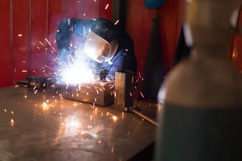 Robotic engineers using welding torch Foto stock