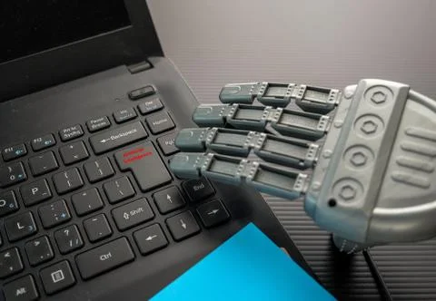 Robotic hand approaching keypad  Stock Photos