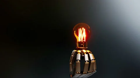 Robotic hand gives light bulb to viewer, creation idea. 動画素材 98434337