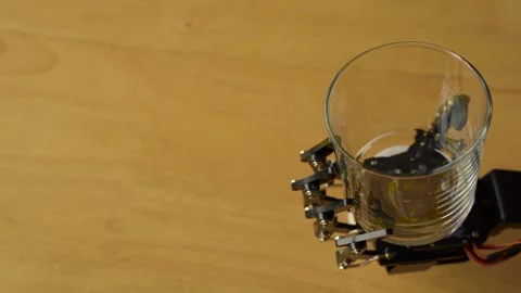 Robotic Hand Holding an Empty Glass Stock Footage 255167154