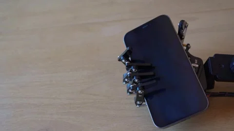 Robotic Hand Holding Iphone Stock Footage 247677433
