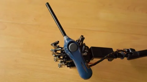 Robotic Hand Holding a Large Blue BIC Lighter in its Hand Stock Footage 255167140