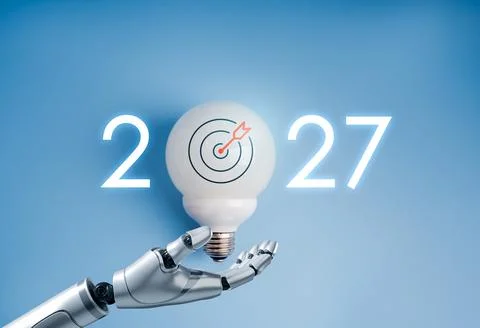 Robotic hand holding light bulb with target symbol and 2027 new year number.. Fotos de archivo