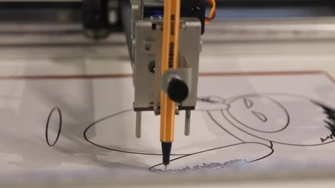 Robotic hand programmed to the computer to draw Stock Footage 124503103