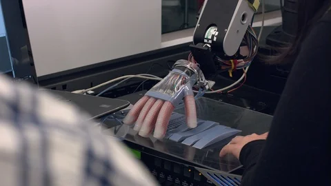 Robotic hand touching plain and zif-zag surface Stock Footage 93520701