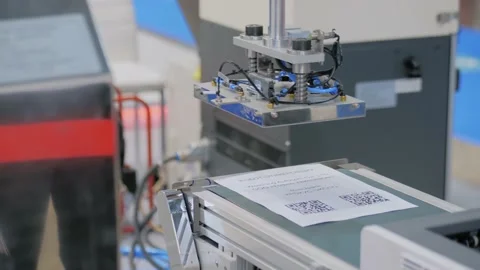 Robotic labeller arm manipulator: automatic label applicator at robot exhibition Stock Footage 155024980