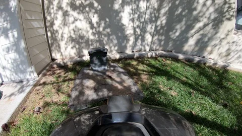 Robotic lawn mower docking itself into charging station Stock Footage 120276355