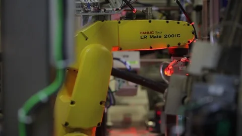 Robotic machine arm. Moving small boxes Stock Footage 101706435