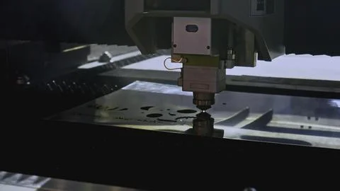 Robotic machine carves patterns on metal. Media. Artificial intelligence in Stock Photos