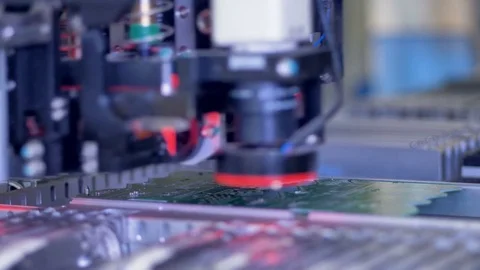 Robotic machine manufacturing printed circuit board on modern factory. 4K. Stock-Footage 78176950