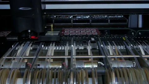 Robotic machine in work processing, installing elements on PCB by Pakito. Stock Footage 71203403