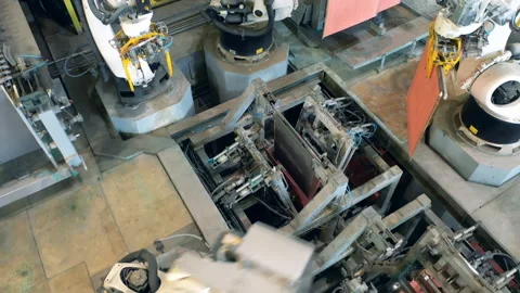 Robotic machinery complex is processing copper plates Stock Footage 159489731