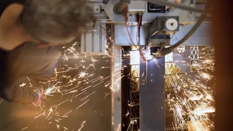 Robotic Metal Cutting Machine Operator Working in an Industrial Factory Stock Footage 342293624
