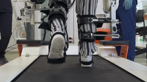Robotic Physical Therapy Session on Treadmill Stock Footage