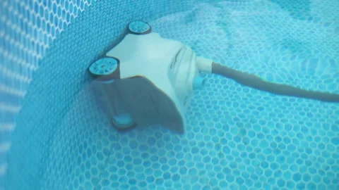 Robotic Pool Cleaner Automatically Cleans an Above Ground 스톡 동영상 343894786