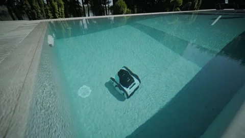 Robotic Pool Cleaner in Outdoor Pool Stock Footage 318748496