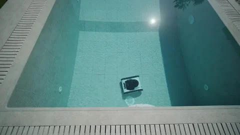 Robotic Pool Cleaner in Outdoor Pool Stock Footage 318748520