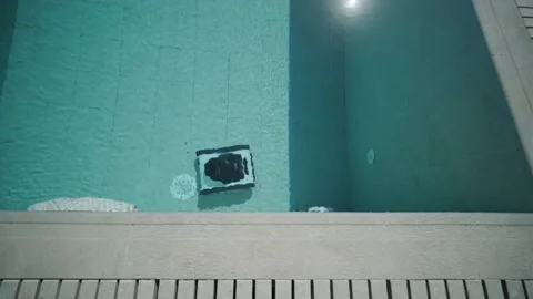 Robotic Pool Cleaner in Outdoor Pool Stock Footage 318748534