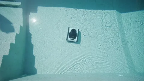 Robotic Pool Cleaner in Outdoor Pool Stock Footage 318748593
