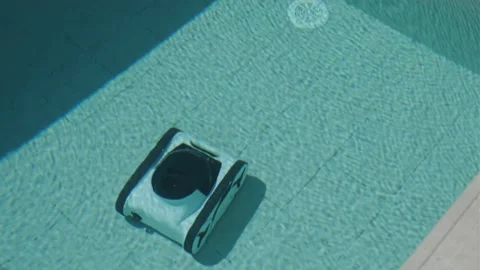 Robotic Pool Cleaner in Outdoor Pool Stock Footage 318748677