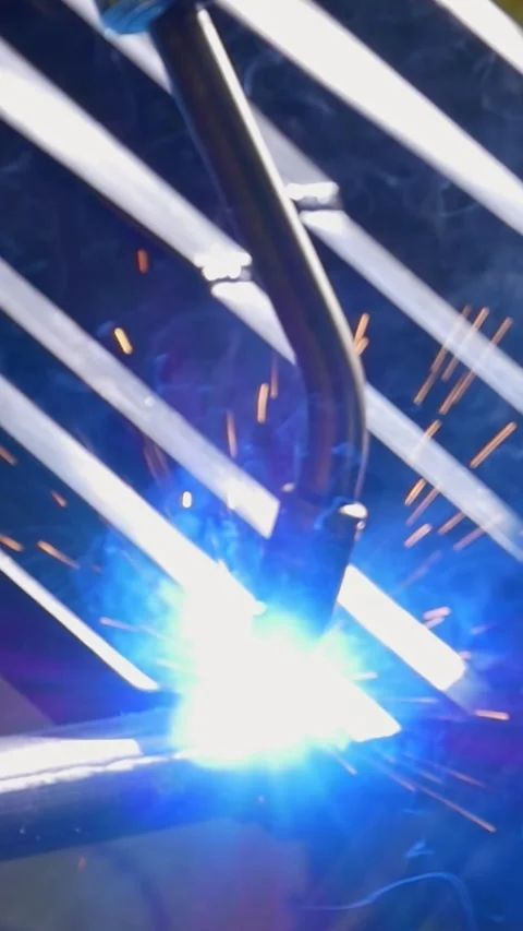 Robotic Precision Forges Pipes With Incandescent Argon Glow Stock Footage 344606762