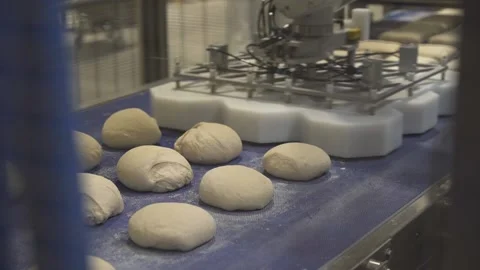 The robotic processing of bread doughs Stock Footage 210465637