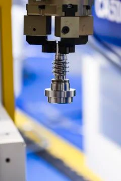 Robotic programmed robot arm. Industrial exhibition of machine tools. Stock Photos