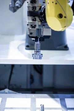 Robotic programmed robot arm. Industrial exhibition of machine tools. Stock Photos