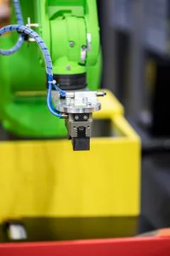 Robotic programmed robot arm. Industrial exhibition of machine tools. Stock Photos