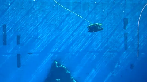 Robotic submersible exploring a mysterious deep water environment with sun rays Stock Footage 328988474