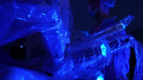Robotic surgeon arms coated in plastic. Robot-assisted surgery in modern Stock Footage 335167650
