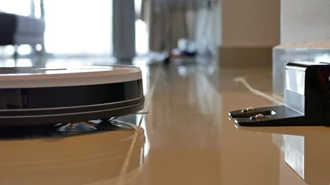 Robotic vacuum cleaner back to the charging dock when battery runs low. 動画素材 130718164