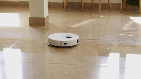 Robotic vacuum cleaner cleaning shiny tiled floor Vídeos de archivo 341961998