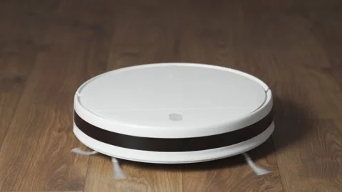 The robotic vacuum cleaner drives automatically Stock Footage 142269424