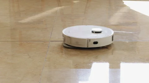 Robotic vacuum cleaner mopping tiled floor Vídeos de archivo 341962201