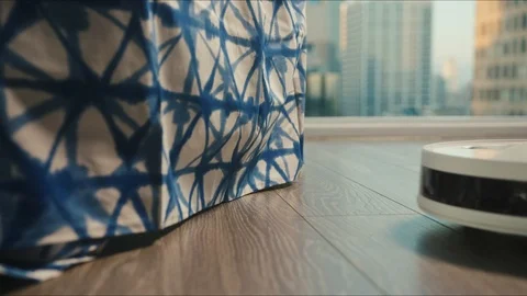 Robotic vacuum cleaner riding around apartments Видео 127459764