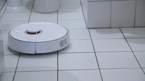 Robotic Vacuum Cleaner Roborock navigating around objects on white bathroom 動画素材 145278564