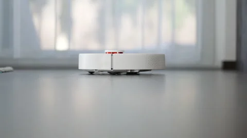 Robotic Vacuum Cleaner in the Room Stock Footage 249976427