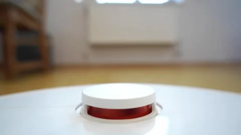 Robotic Vacuum Cleaner Top Button in Bright Modern Home Interior Stock Footage 321946355