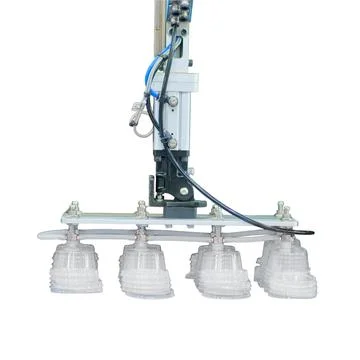 Robotic vacuum gripper lifting stack of plastic cups. Automated production .. Stock Photos