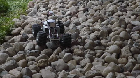Robotic vehicle moving through the rocks Stock Footage 93580212